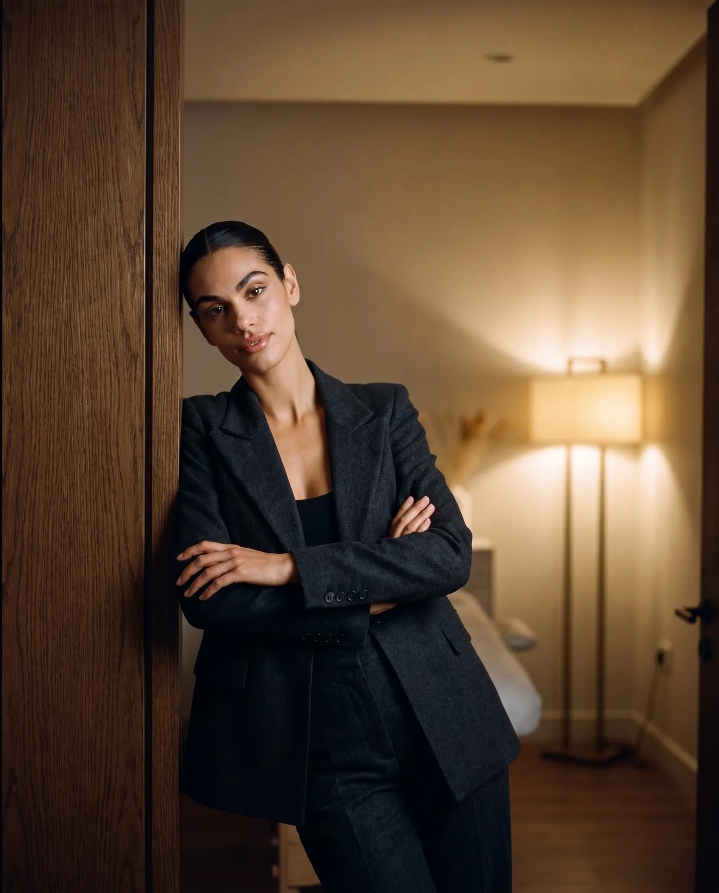 SOPHIE, leaning in a doorway